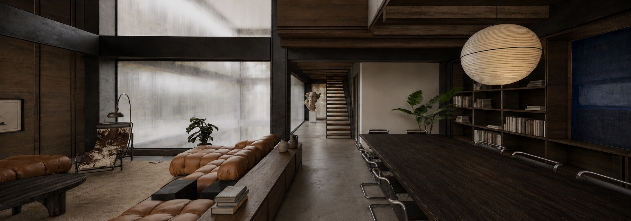 El Penthouse &middot; el estar y la mesa larga, con la biblioteca al fondo